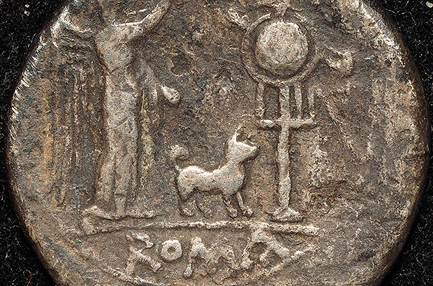 Roman coin from the 2nd century BC depicting a deity, an altar and a dog