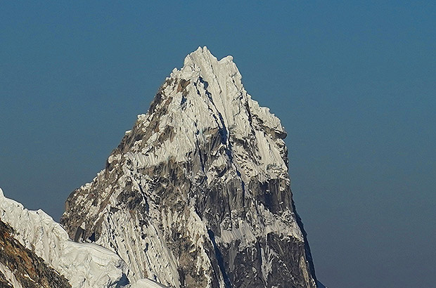 The ominous summit tower of nevado Taullaraju. Three years ago, a team from Mexico of 6 people died while trying to climb this mountain....