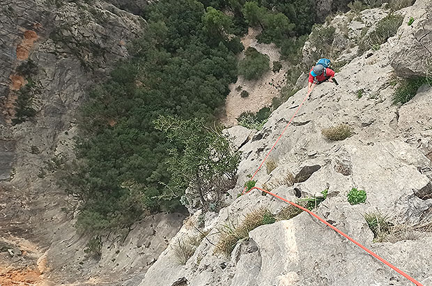 On the top rope of a multipitch in Sa Gubia