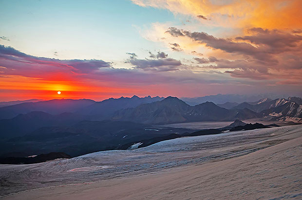 Colorful sunset over the Main Caucasian Range. View from the east slopes of Elbrus