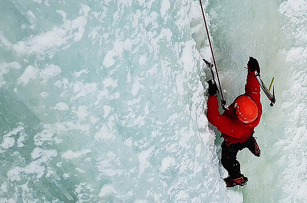 Iceclimbing training on the blue ice of frozen waterfalls in Norway