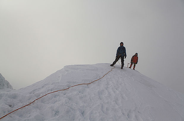 Climbing to the top of Mount Belukha in the fog.