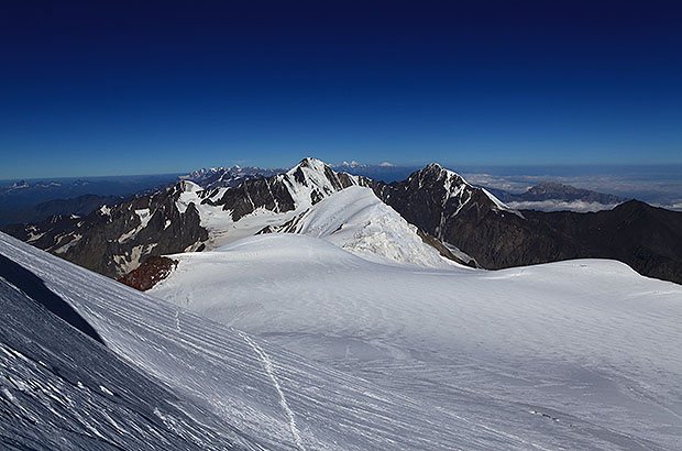 View to the main Caucasian Range from the height of the summit of Mount Kazbek