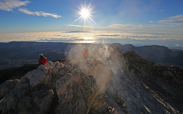 Climbing the crater of the Teide volcano. There are numerous active fumaroles in the crater. On the horizon there is the neighboring island of Gran Canaria