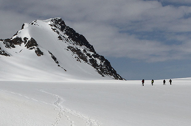Climbing team crosses glacier at the base of Mount Elbrus. East route