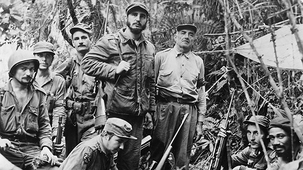 The leader of the Cuban Revolution, Fidel Castro, with his associates in the Sierra Maestra Mountains