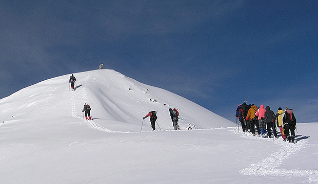 Numerous groups of climbers ascending from the south attempt Mount Elbrus summit