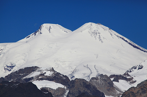The two-headed giant Elbrus dome stands apart from all other mountains of the Caucasus