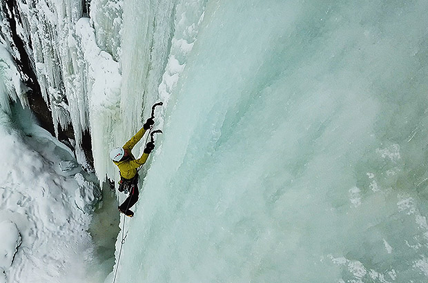 Ice climbing training on natural ice of frozen waterfalls