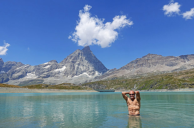 Pure glamor and no extreme - swimming in a mountain lake at the foot of the Matterhorn, Alps, Italy / Switzerland