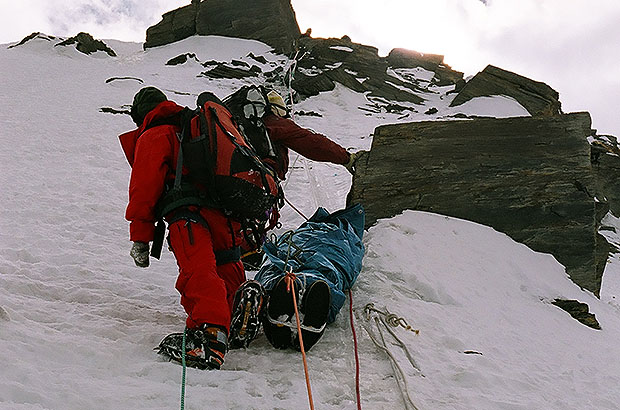 The descent of the body of the climber to camp 5600 in the north route of Khan Tengri