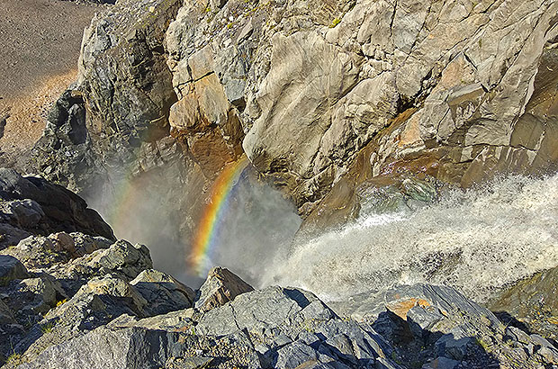 Rainbow in mountain waterfall, Caucasus