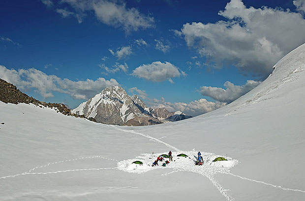 Camp in the snow field, Dykh Tau massif on the background