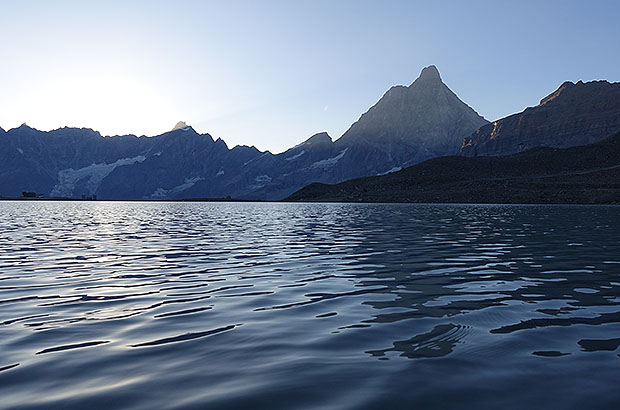 Reflection of the Matterhorn in the lake at sunrise, Italy