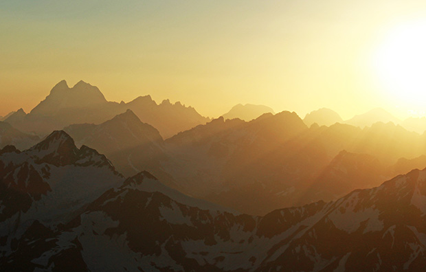 Sunset in the Elbrus region - the silhouette of Mount Ushba clearly dominates the horizon