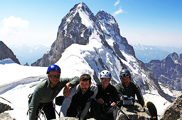 At the top of Shchurovsky Peak, behind is Mount Ushba