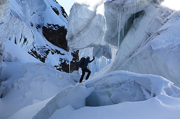 Overcoming a glacial crevasse, climbing Mount Tetnuld