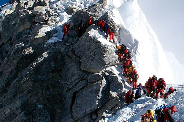 The famous line of climbers close to the summit of Everest