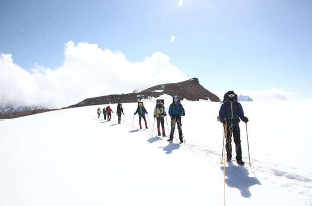 Climbing Mount Elbrus - crossing a closed glacier using trekking poles
